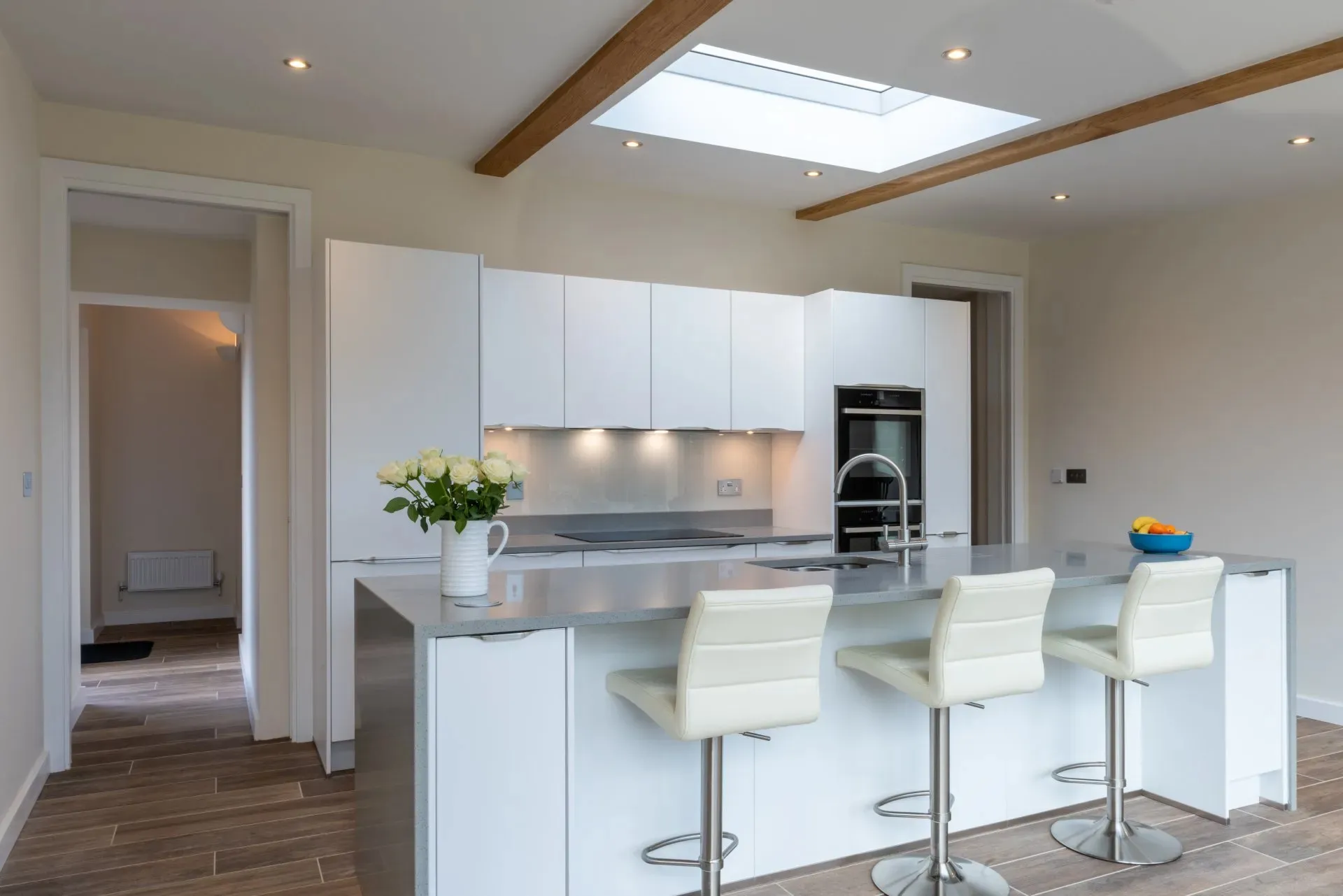 white kitchen with white seating